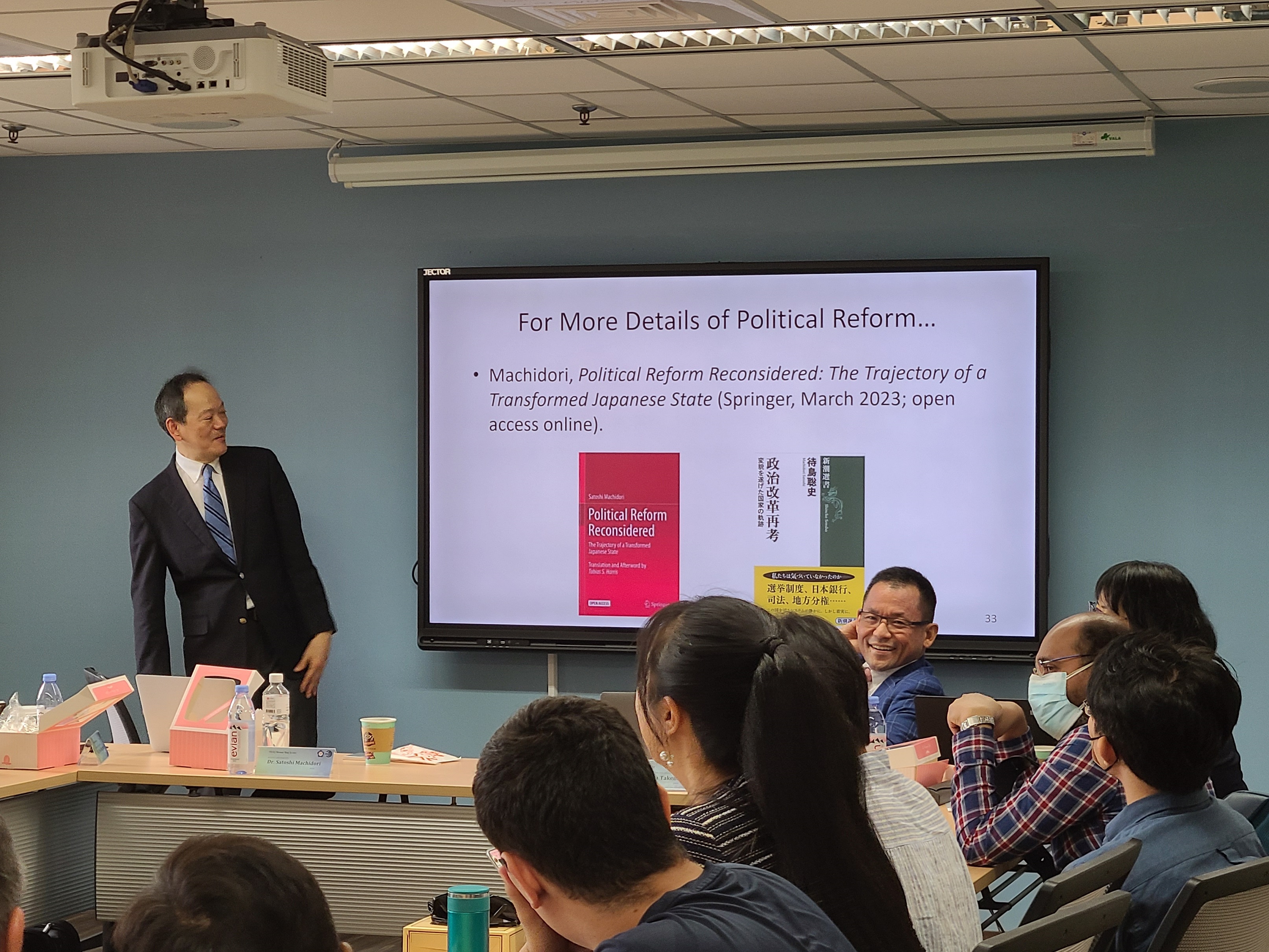 Dr. Satoshi Machidori of Kyoto University (standing left) shared his new book and access to all the attendees.